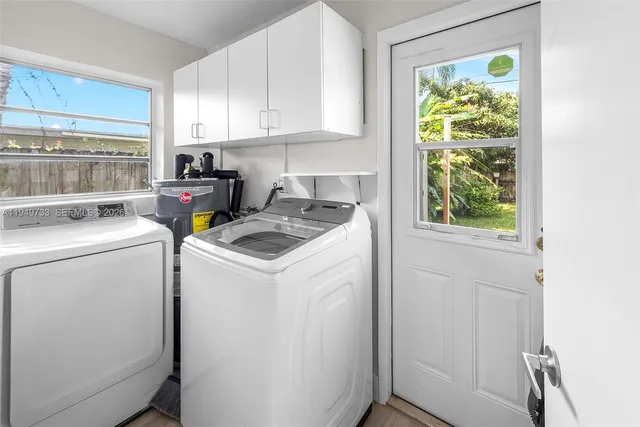 a view of storage and utility room with washer and dryer