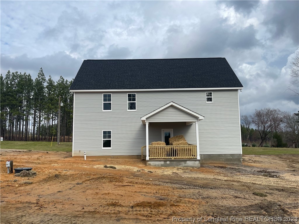 830 Cypress Road Cameron, NC 28326 - Photo 2 of 4 a front view of a house with a yard