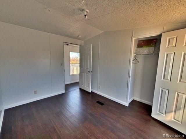 1211 Reed Lane La Junta, CO 81050 - Photo 11 of 17 an empty room with wooden floor and a window