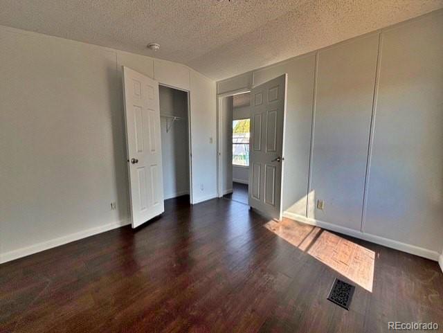 1211 Reed Lane La Junta, CO 81050 - Photo 13 of 17 a view of an empty room with wooden floor