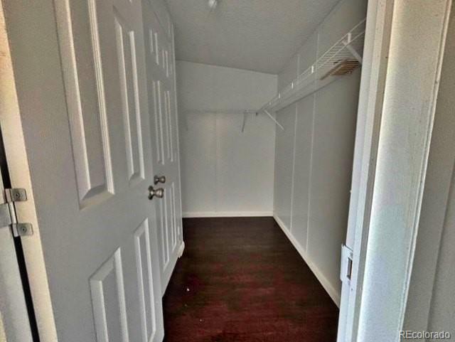 1211 Reed Lane La Junta, CO 81050 - Photo 15 of 17 a view of a hallway with a wooden floor