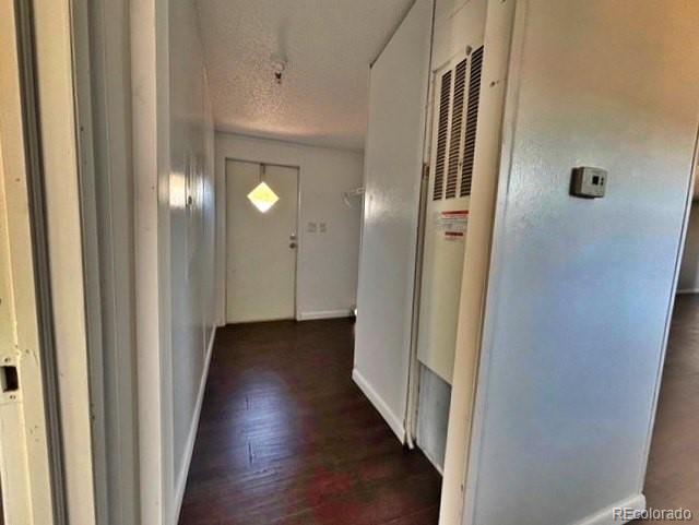 1211 Reed Lane La Junta, CO 81050 - Photo 17 of 17 a view of a hallway with wooden floor