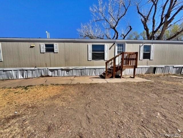 1211 Reed Lane La Junta, CO 81050 - Photo 2 of 17 a view of a house with backyard