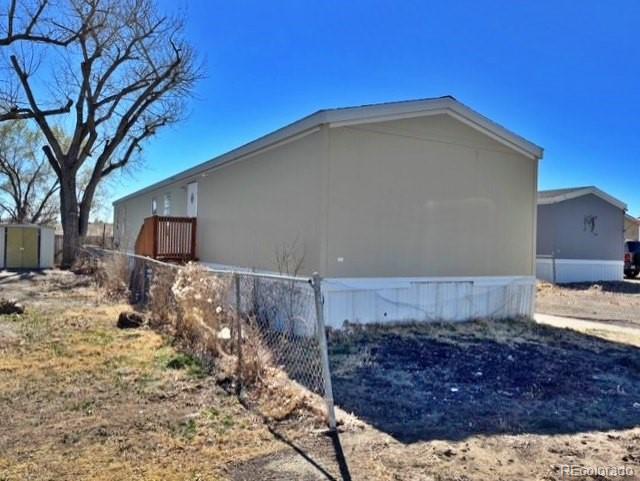 1211 Reed Lane La Junta, CO 81050 - Photo 3 of 17 a view of a house with a snow in the yard