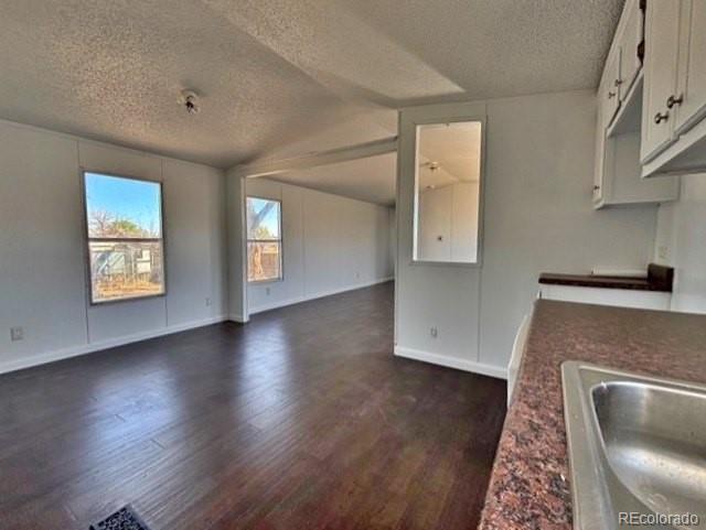 1211 Reed Lane La Junta, CO 81050 - Photo 6 of 17 a view of a kitchen with furniture and a fireplace