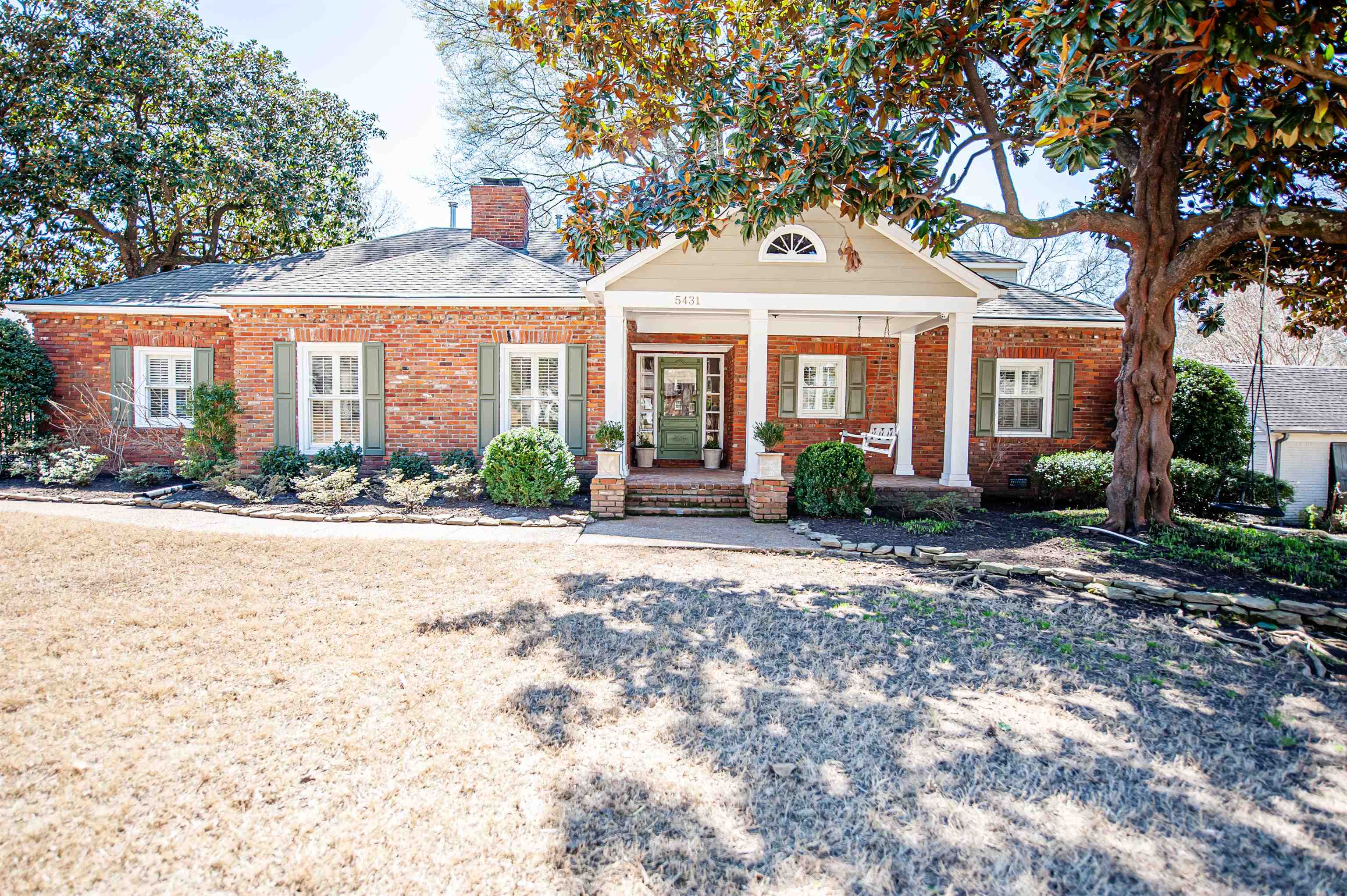 5431 South Angela Road Memphis, TN 38120 - Photo 1 of 25 a front view of a house with garden