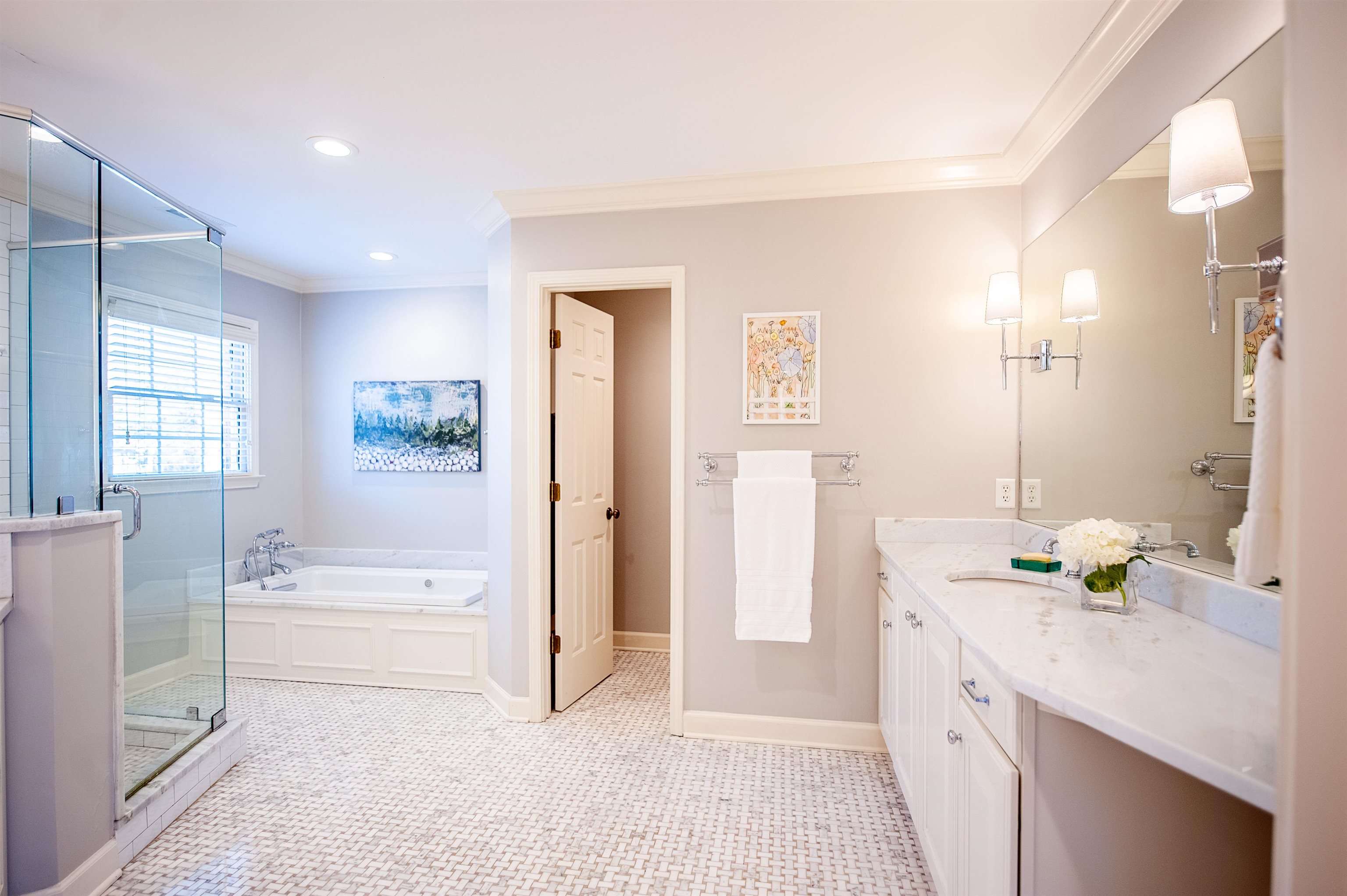 5431 South Angela Road Memphis, TN 38120 - Photo 14 of 25 a spacious bathroom with a double vanity sink a mirror a bathtub and next to a window