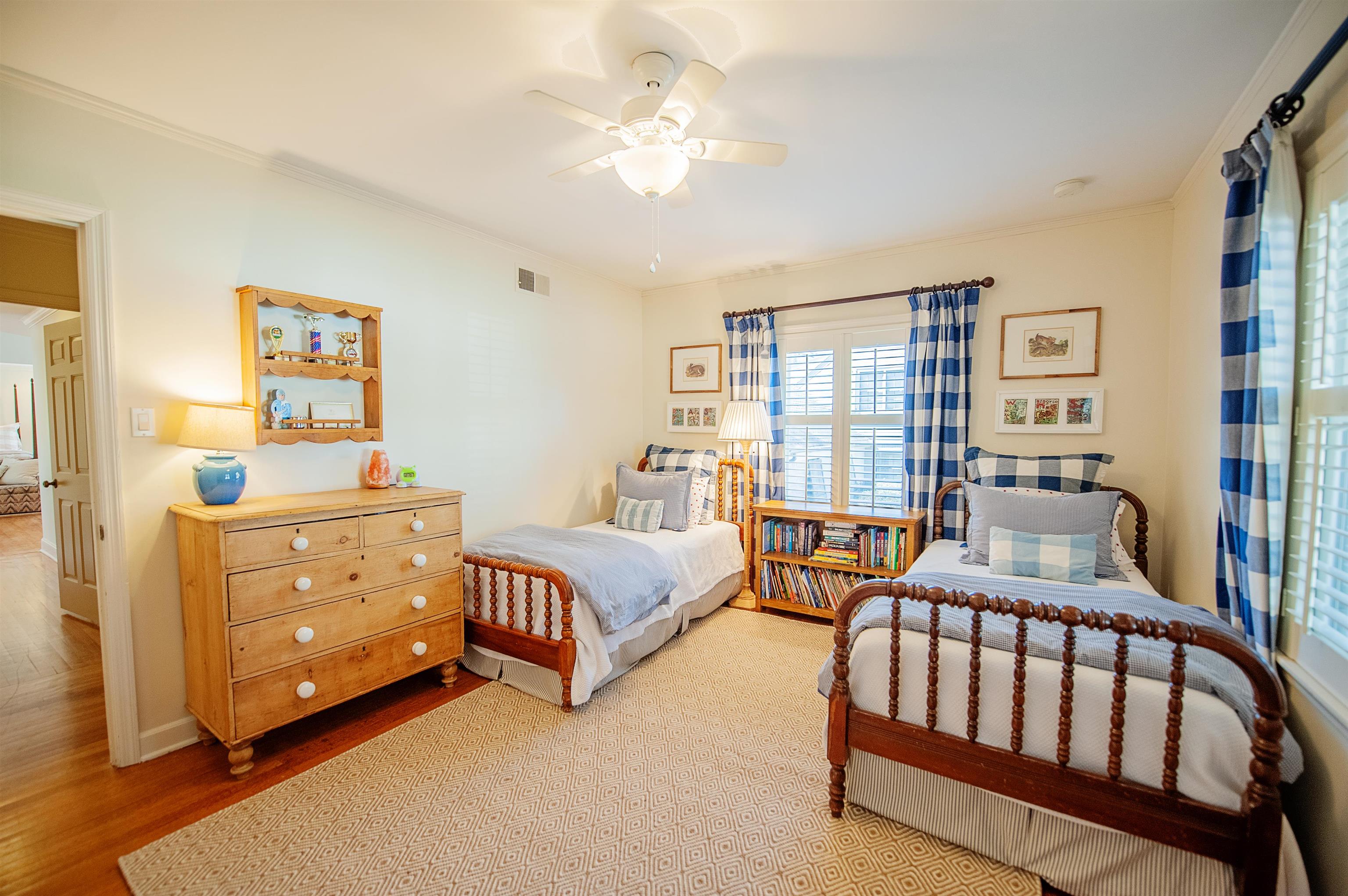 5431 South Angela Road Memphis, TN 38120 - Photo 18 of 25 a bedroom with furniture and a window