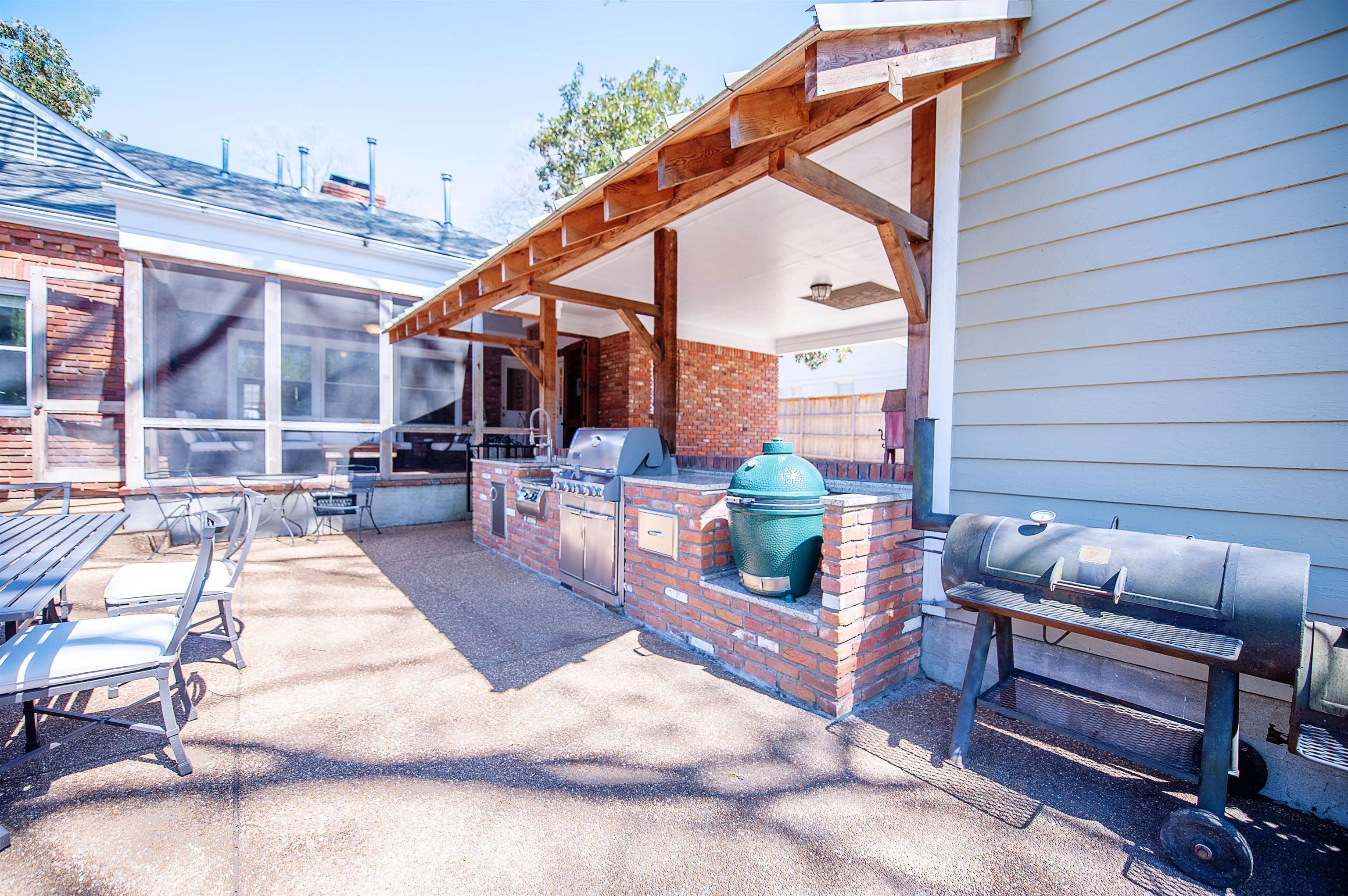5431 South Angela Road Memphis, TN 38120 - Photo 23 of 25 a backyard of a house with seating space