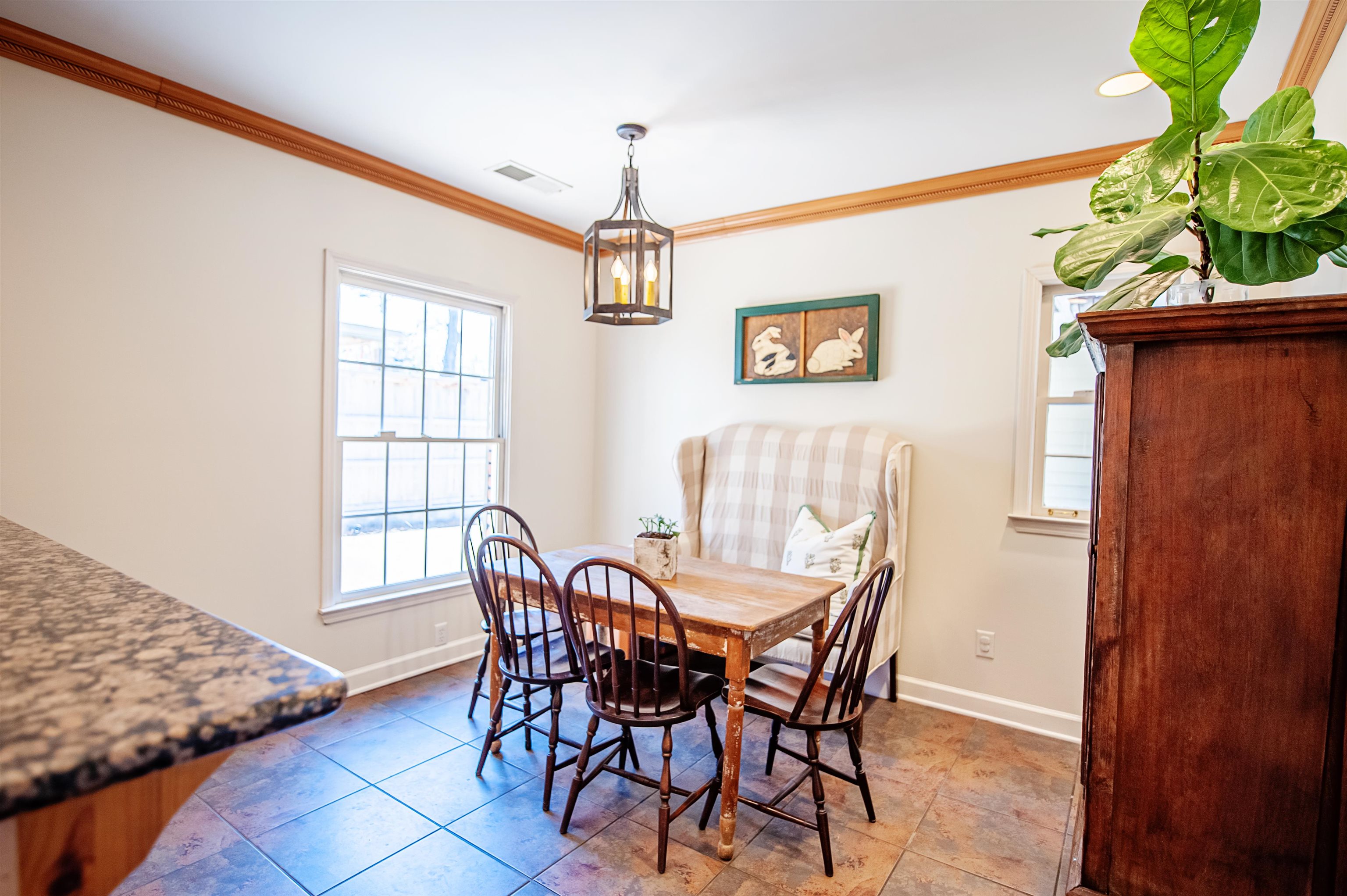 5431 South Angela Road Memphis, TN 38120 - Photo 9 of 25 a view of a dining room with furniture and window