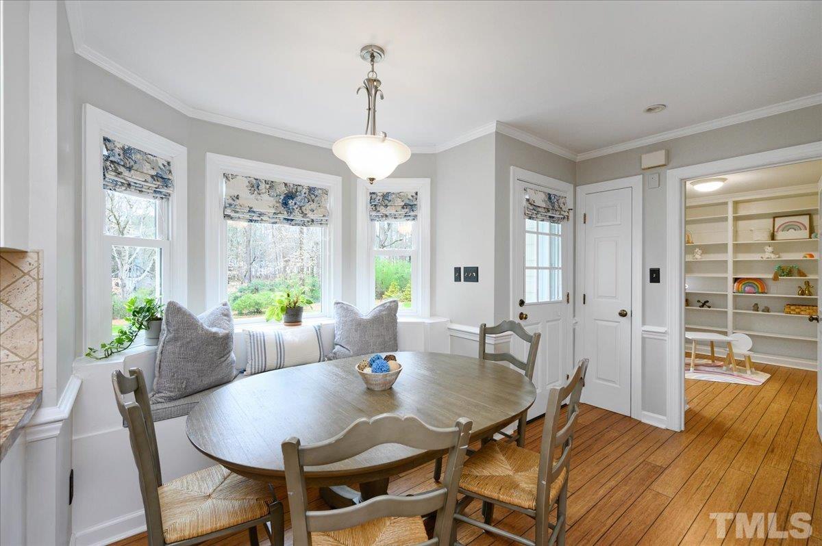 5101 Fielding Drive Raleigh, NC 27606 - Photo 11 of 32 a view of a dining room with furniture window and wooden floor