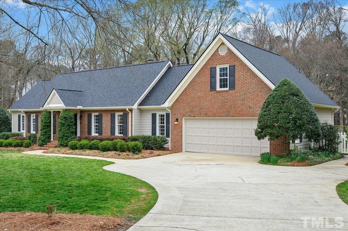 5101 Fielding Drive Raleigh, NC 27606 - Photo 2 of 32 a front view of a house with a yard