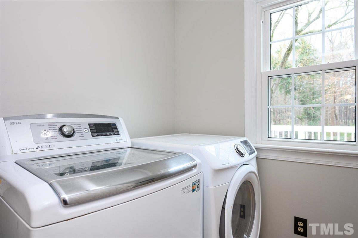 5101 Fielding Drive Raleigh, NC 27606 - Photo 25 of 32 a utility room with dryer and washer