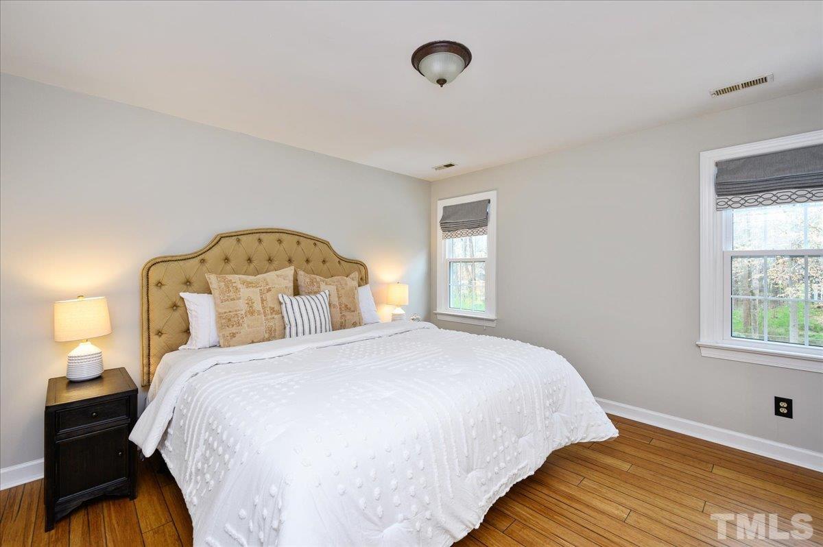 5101 Fielding Drive Raleigh, NC 27606 - Photo 26 of 32 a bedroom with a bed and window