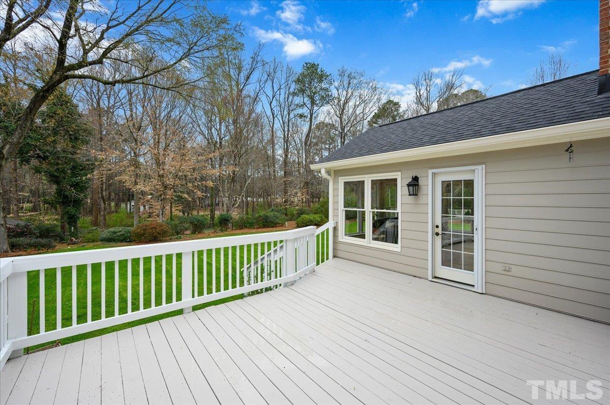 5101 Fielding Drive Raleigh, NC 27606 - Photo 29 of 32 a view of a house with a wooden deck