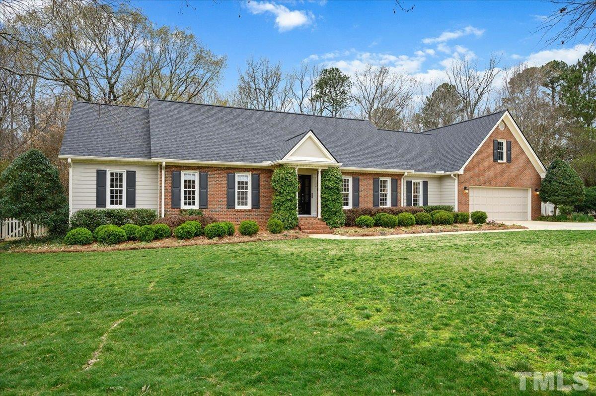 5101 Fielding Drive Raleigh, NC 27606 - Photo 3 of 32 a front view of a house with a yard