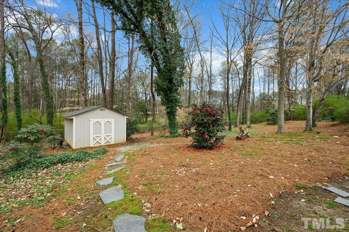 5101 Fielding Drive Raleigh, NC 27606 - Photo 32 of 32 a view of a house with a yard and tree s