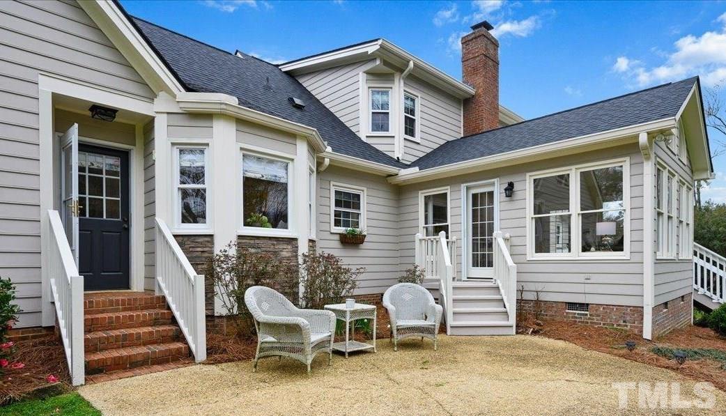 5101 Fielding Drive Raleigh, NC 27606 - Photo 4 of 32 a view of a house with a lounge chair and porch