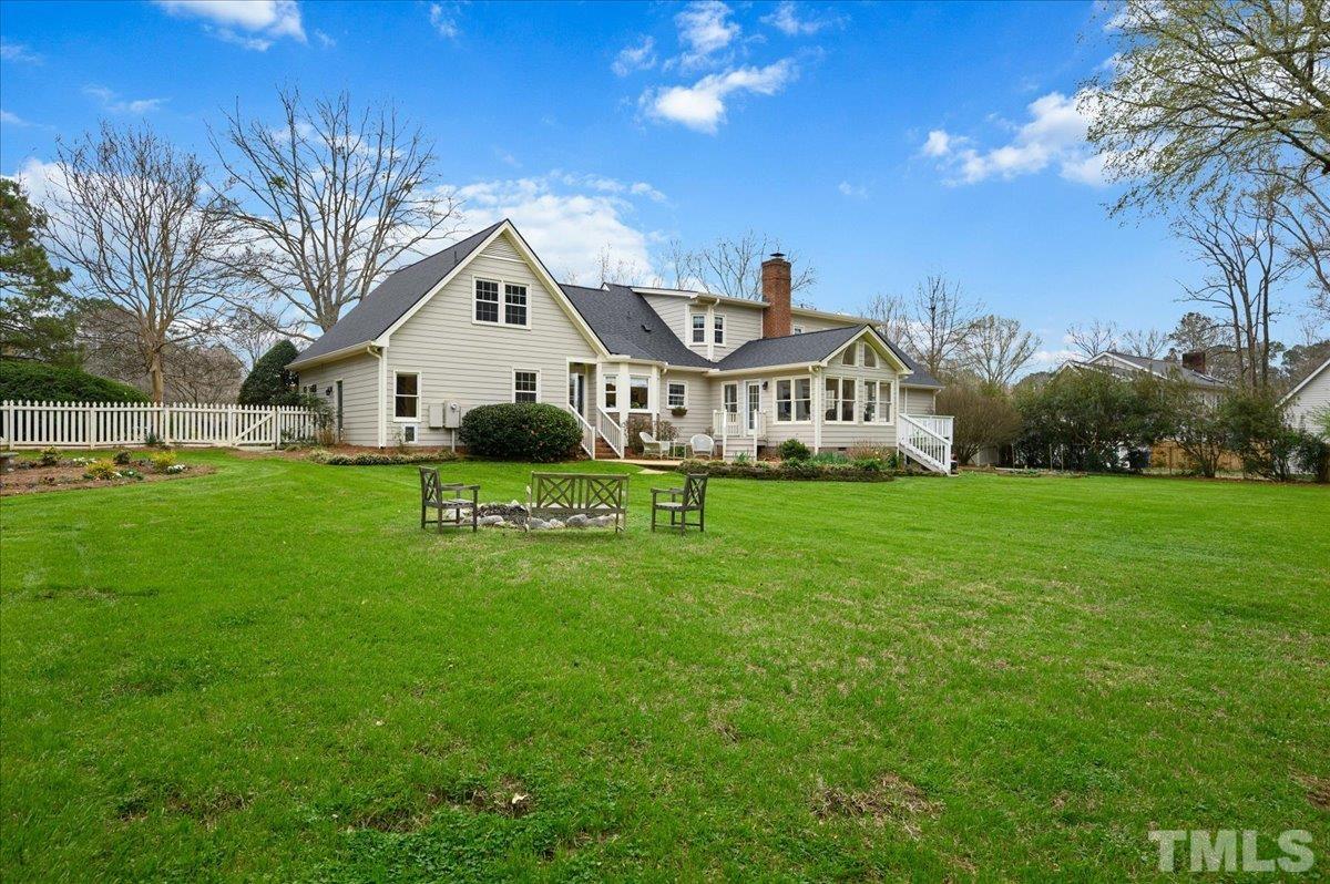5101 Fielding Drive Raleigh, NC 27606 - Photo 5 of 32 a front view of a house with a yard and garage