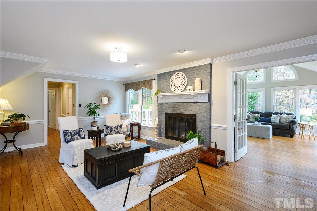 5101 Fielding Drive Raleigh, NC 27606 - Photo 8 of 32 a living room with furniture and a fireplace