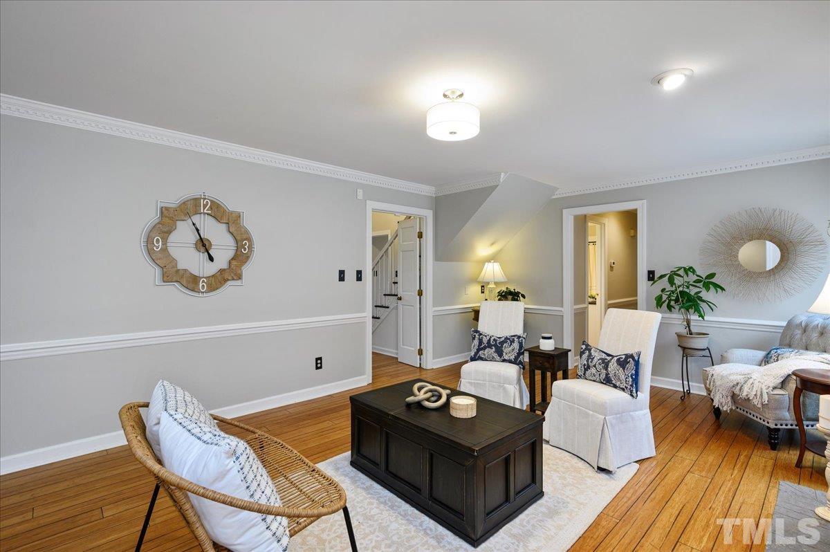 5101 Fielding Drive Raleigh, NC 27606 - Photo 9 of 32 a living room with furniture