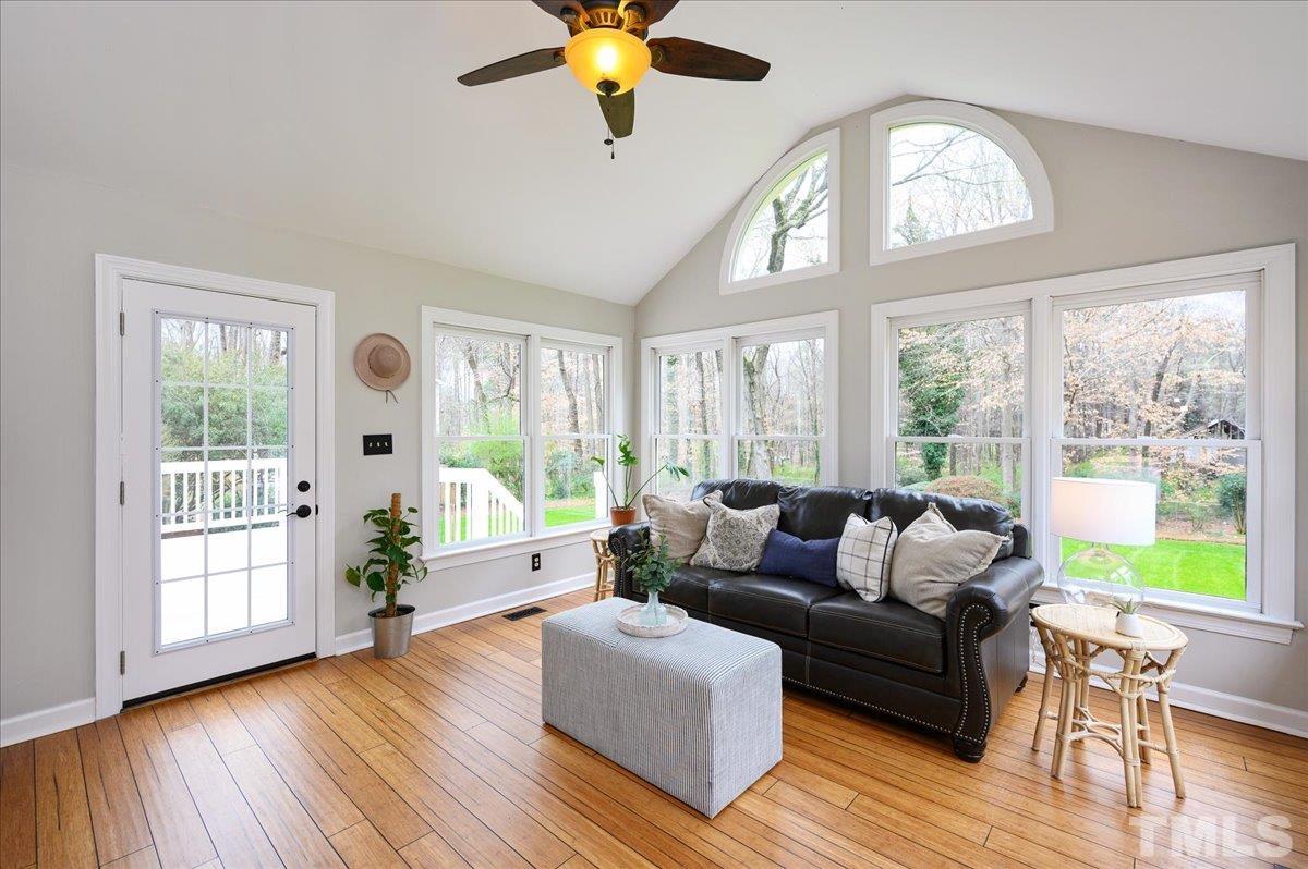5101 Fielding Drive Raleigh, NC 27606 - Photo 10 of 32 a living room with furniture and a large window