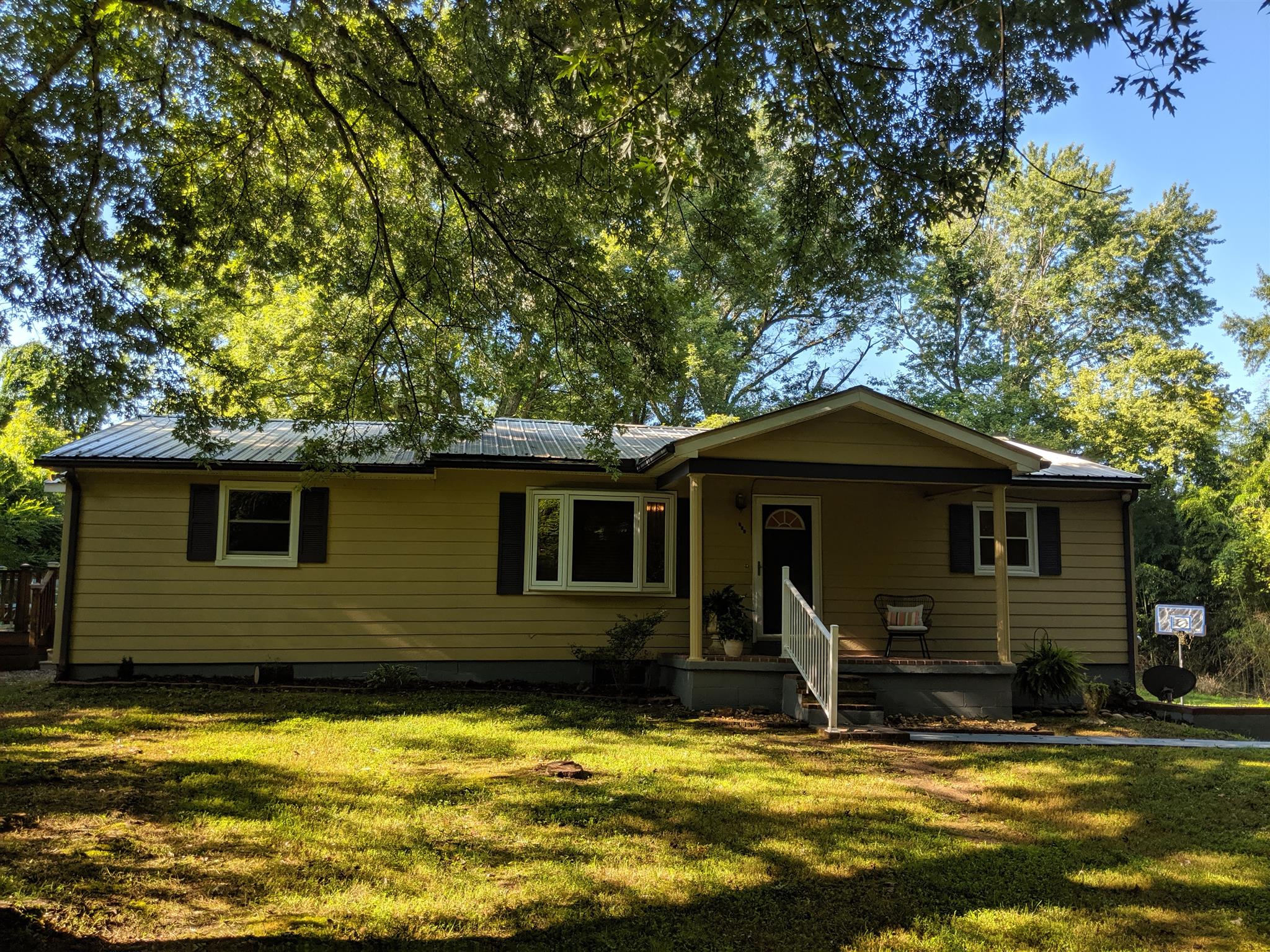 136 River Road Morrison, TN 37357 - Photo 2 of 24 Shady lot, covered front porch, and deck on the side.