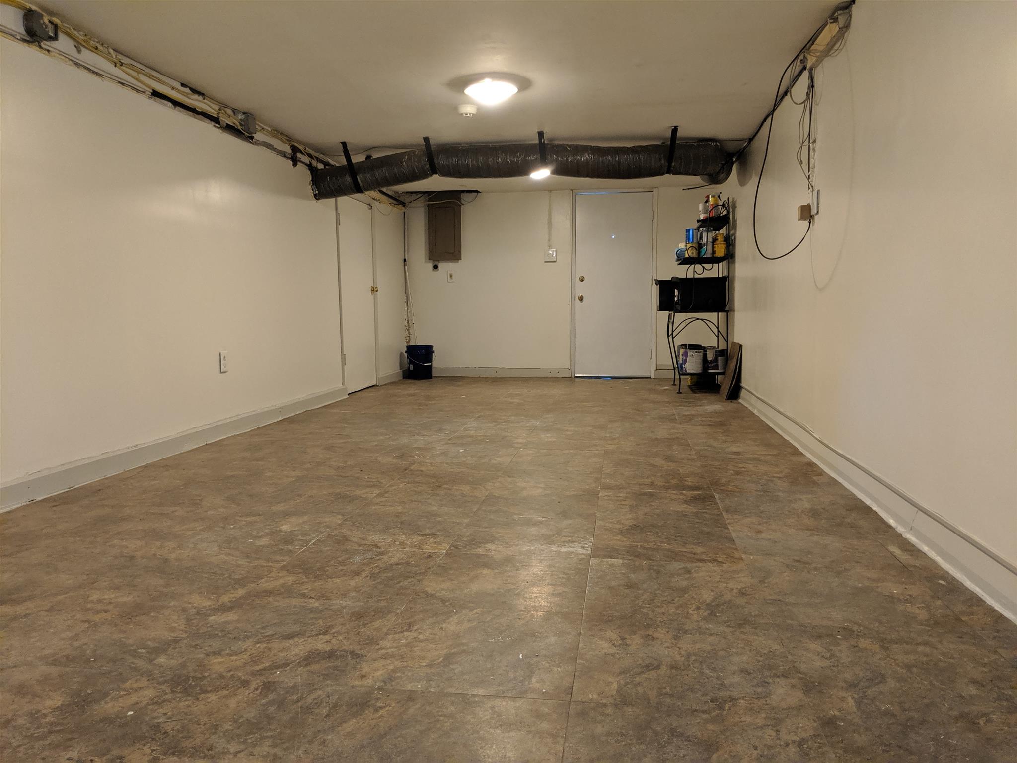 136 River Road Morrison, TN 37357 - Photo 6 of 24 One side of basement has newer vinyl flooring and has been newly painted. Washer and dryer are downstairs.