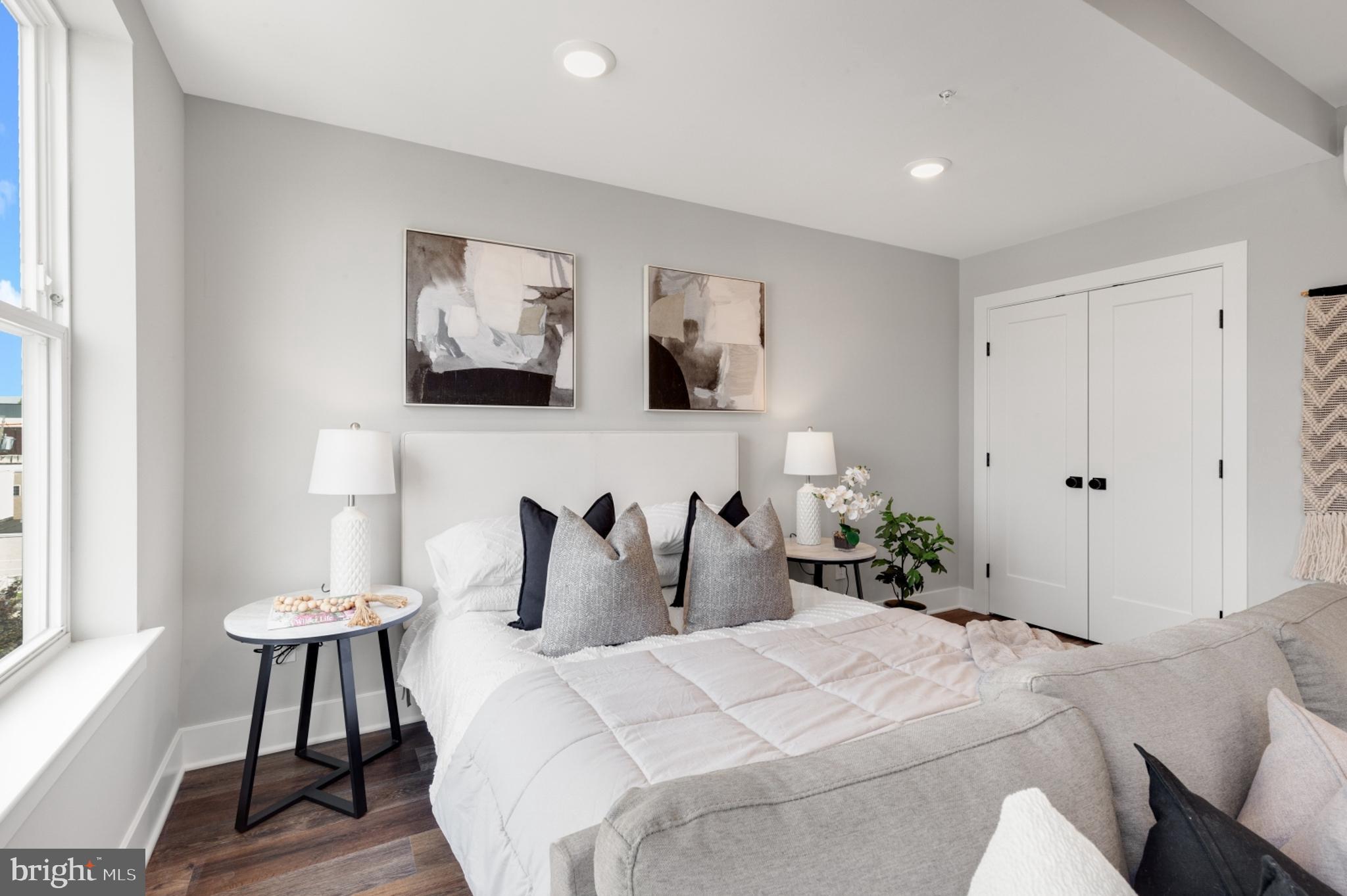 1924 North Front Street, Unit 401 Philadelphia, PA 19122 - Photo 11 of 30 a bedroom with a bed and a painting on the wall