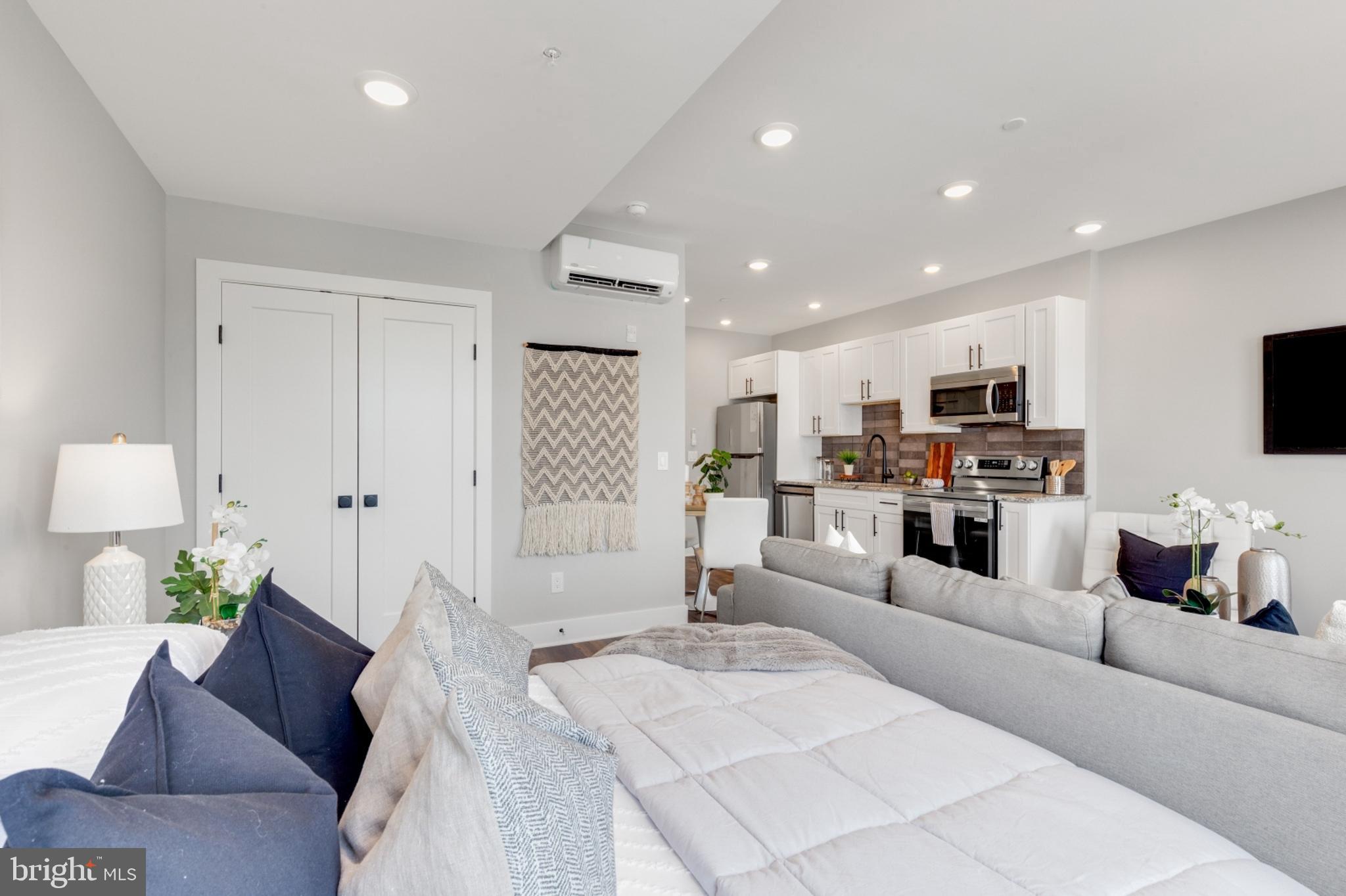 1924 North Front Street, Unit 401 Philadelphia, PA 19122 - Photo 12 of 30 a living room with furniture and a flat screen tv