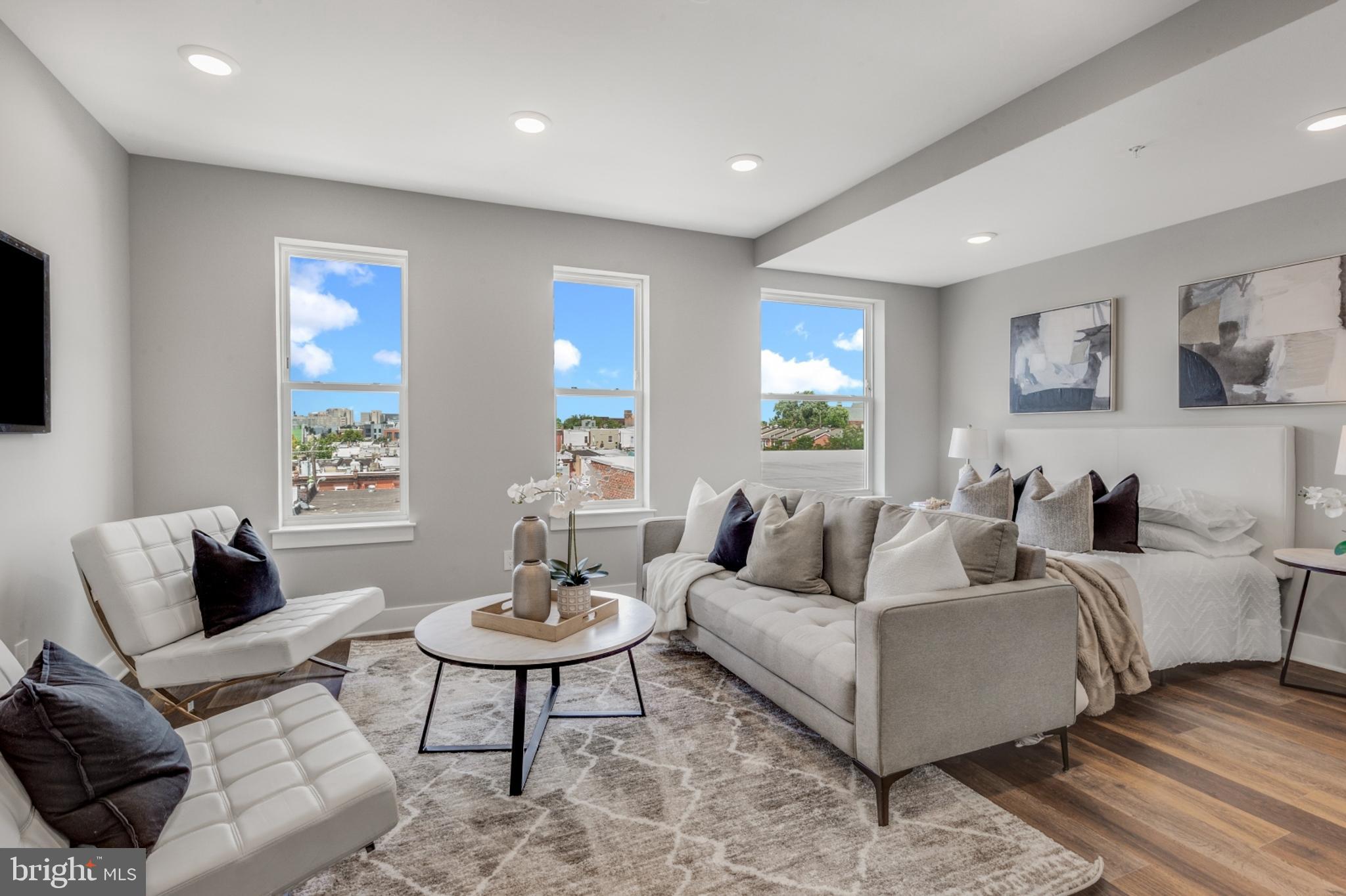 1924 North Front Street, Unit 401 Philadelphia, PA 19122 - Photo 2 of 30 a living room with furniture and a potted plant