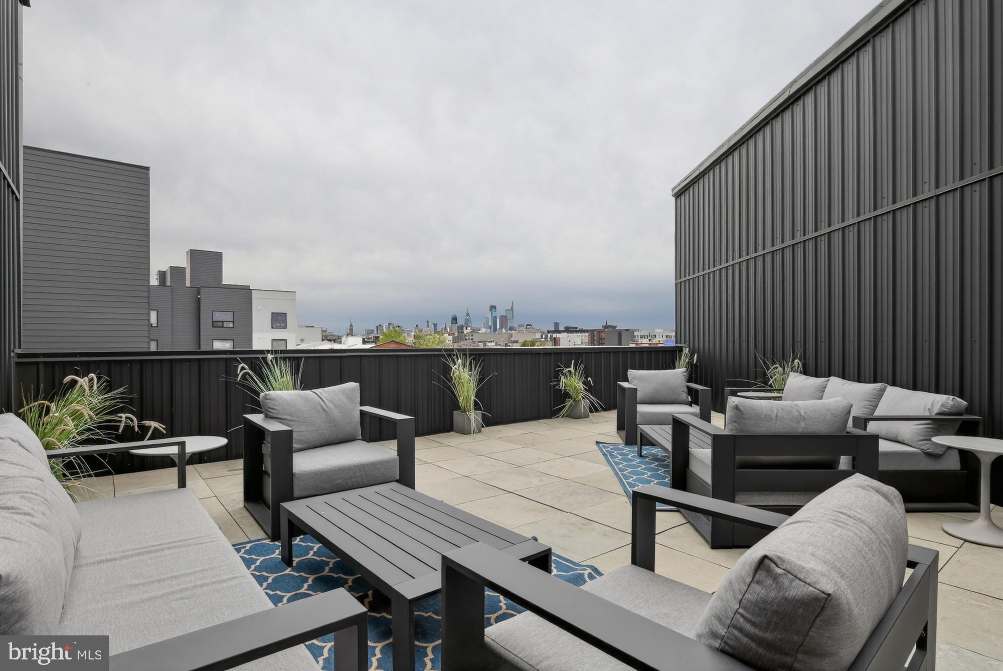 1924 North Front Street, Unit 401 Philadelphia, PA 19122 - Photo 31 of 31 a outdoor living space with furniture and city view
