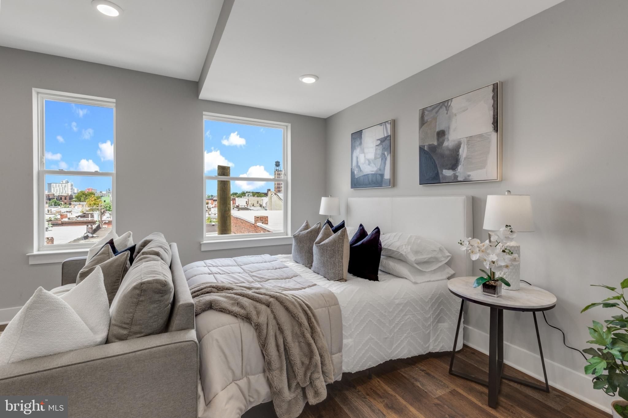 1924 North Front Street, Unit 401 Philadelphia, PA 19122 - Photo 9 of 30 a bedroom with double bed and a couch