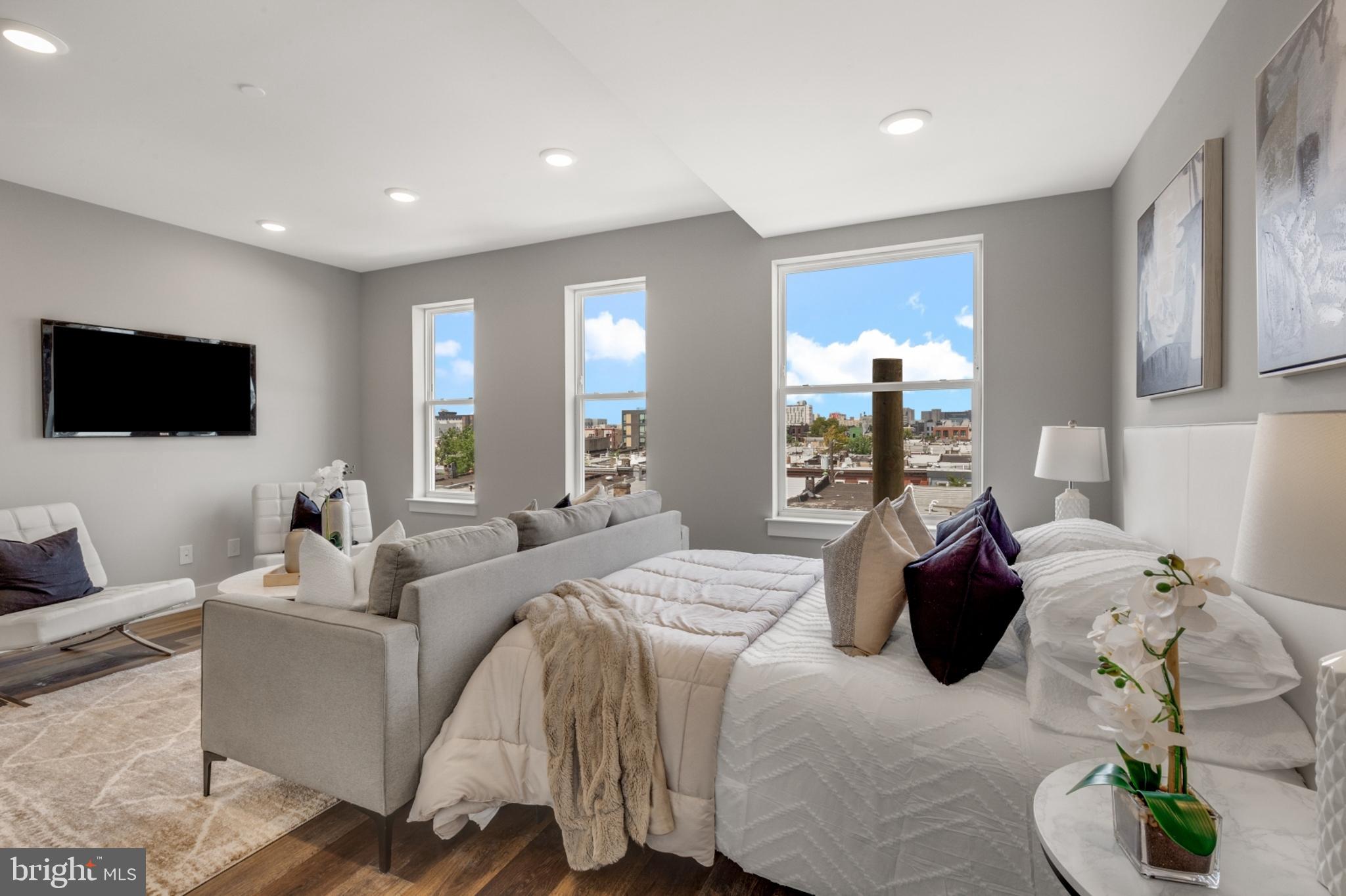 1924 North Front Street, Unit 401 Philadelphia, PA 19122 - Photo 10 of 30 a living room with furniture and a flat screen tv