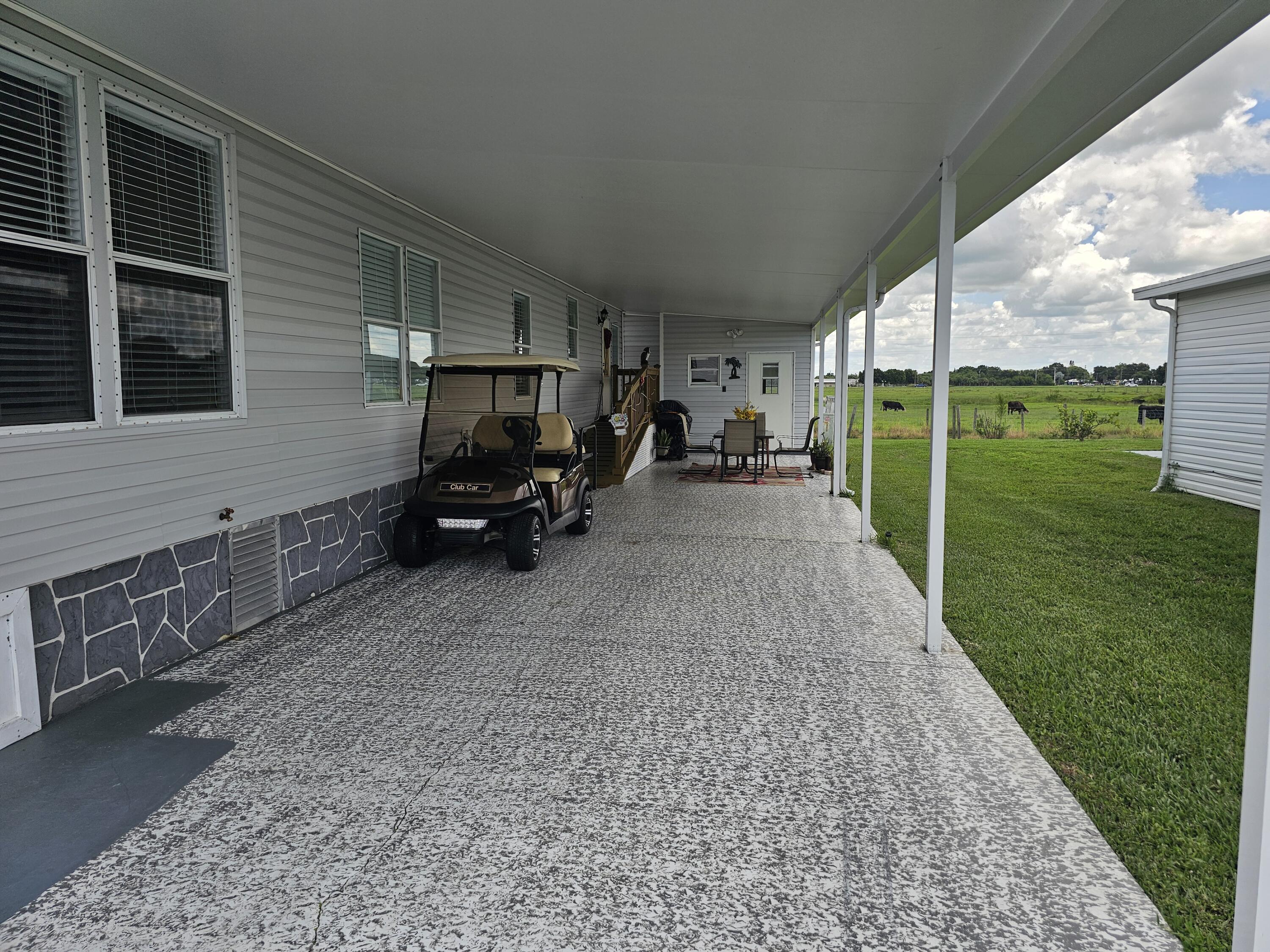 1601 Highway 441, Unit 28 Okeechobee, FL 34974 - Photo 21 of 35 a view of a back yard of the house