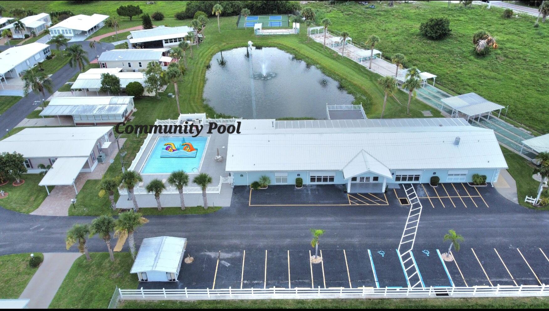 1601 Highway 441, Unit 28 Okeechobee, FL 34974 - Photo 29 of 35 an aerial view of a house with outdoor space pool patio and lake view