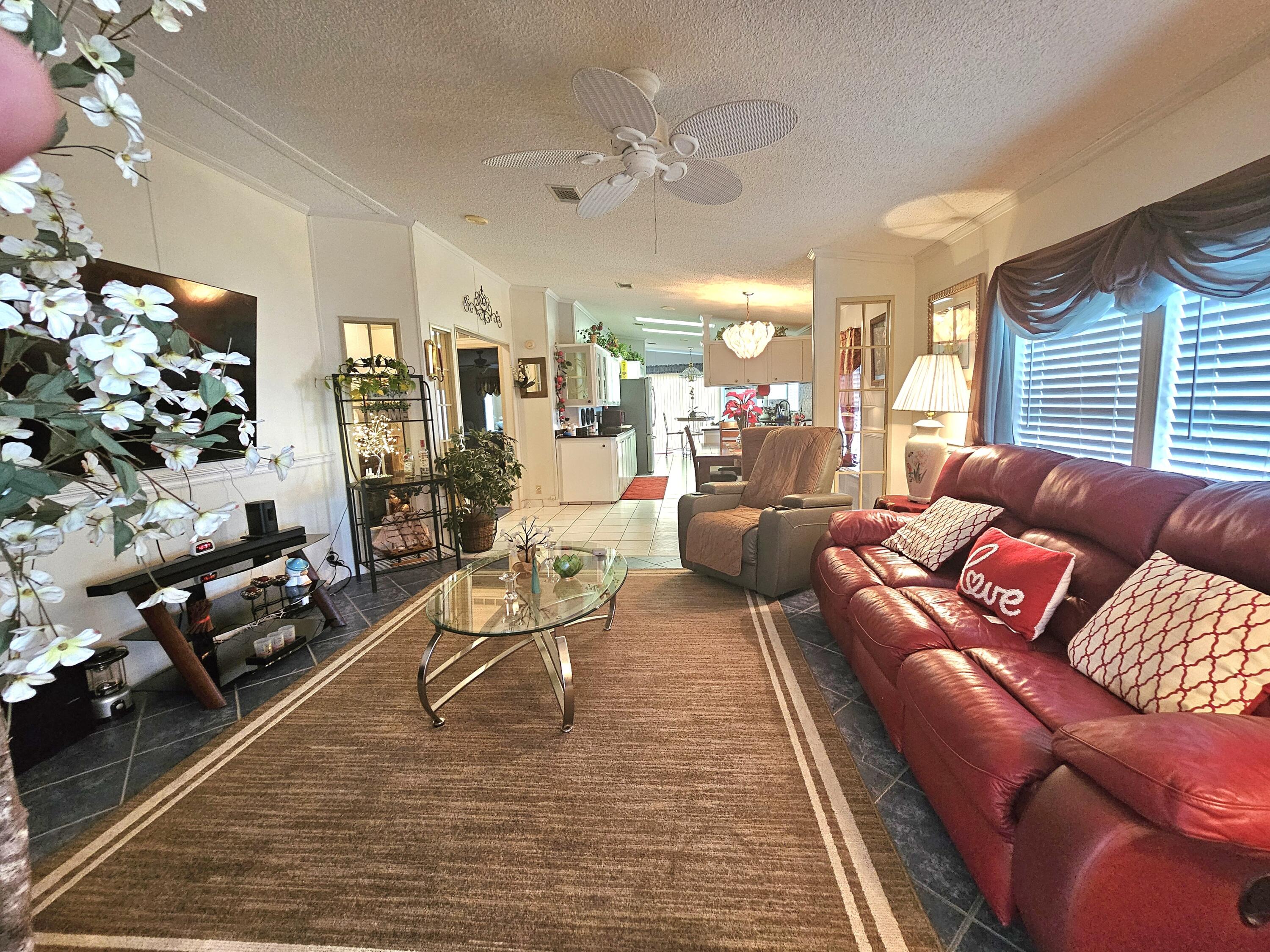 1601 Highway 441, Unit 28 Okeechobee, FL 34974 - Photo 3 of 35 a living room with furniture and a large window