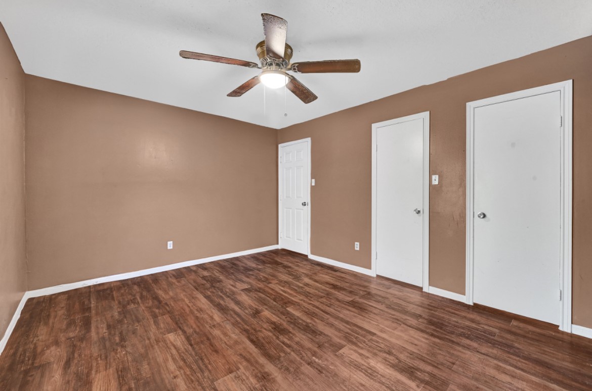 3403 Dryburgh Court Huffman, TX 77336 - Photo 14 of 18 a view of an empty room with wooden floor