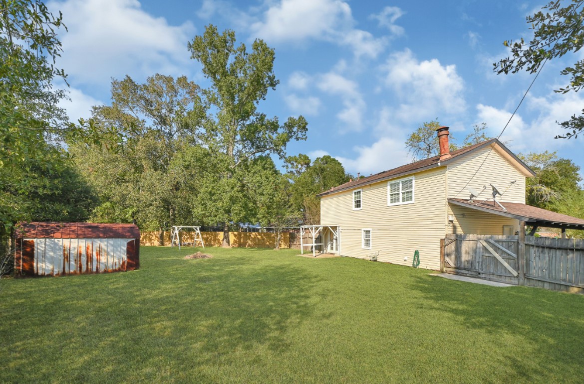 3403 Dryburgh Court Huffman, TX 77336 - Photo 17 of 18 a view of a house with a yard