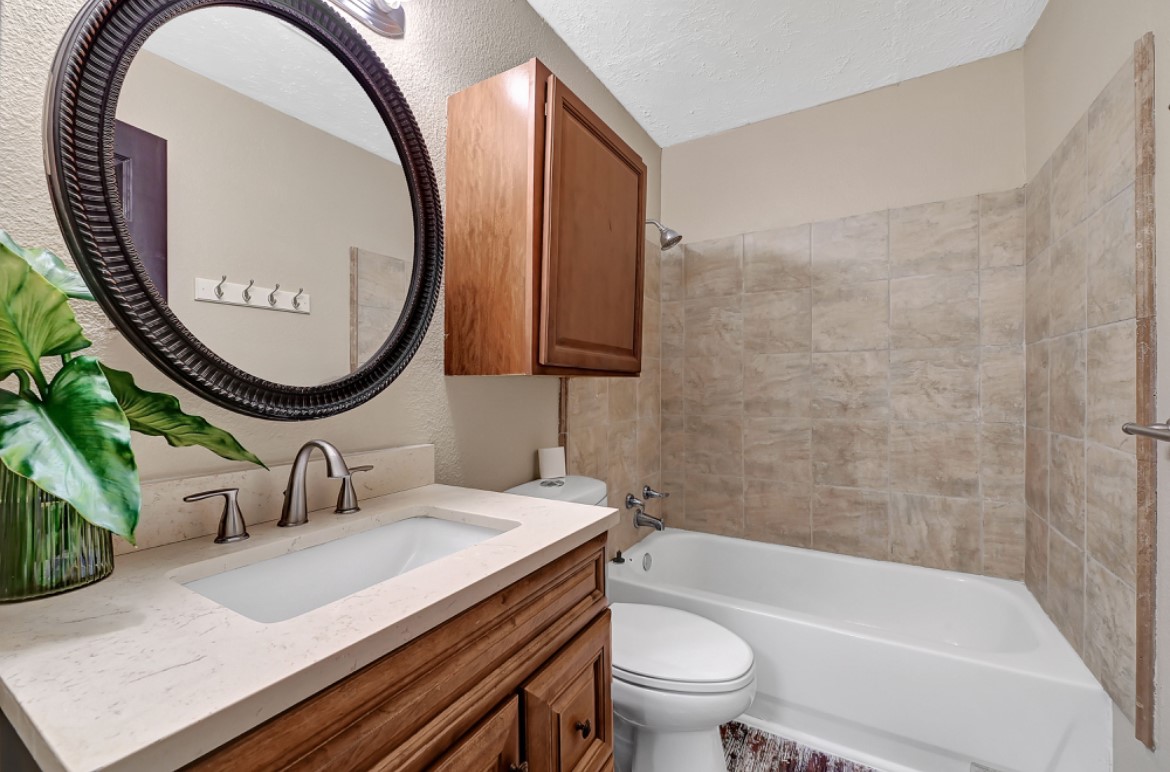 3403 Dryburgh Court Huffman, TX 77336 - Photo 6 of 18 a bathroom with a sink and a mirror