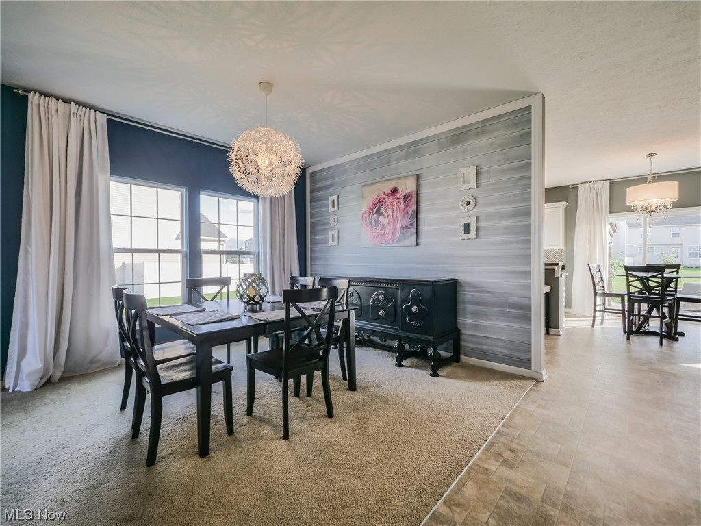 37571 Amber Way North Ridgeville, OH 44039 - Photo 6 of 35 Tiled dining room featuring a chandelier