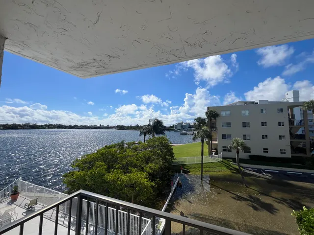 a view of a balcony with wooden floor