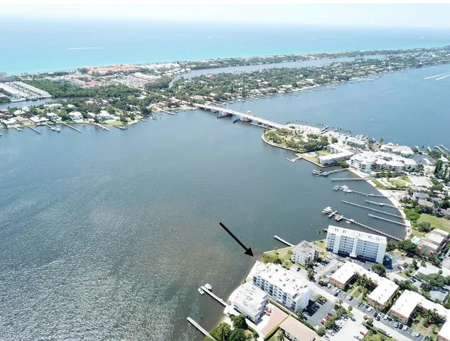 an aerial view of a houses with a lake view