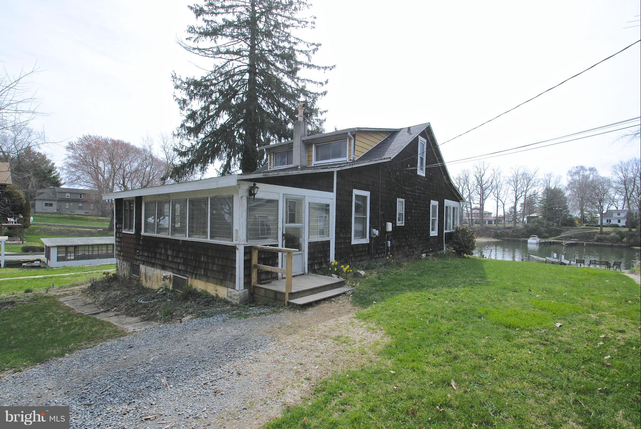 717 Red Cedar Road Annapolis, MD 21409 - Photo 2 of 30 a view of a house with a yard and sitting area
