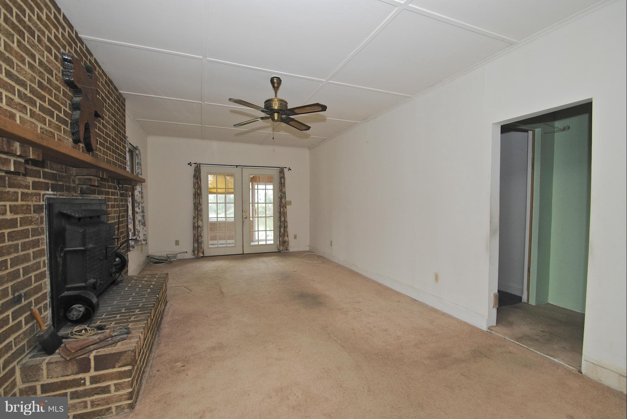 717 Red Cedar Road Annapolis, MD 21409 - Photo 11 of 30 a view of a livingroom with a fireplace and window