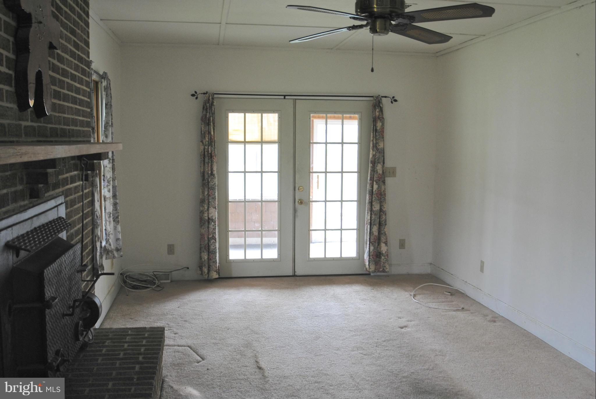 717 Red Cedar Road Annapolis, MD 21409 - Photo 13 of 30 a view of an empty room with a fireplace