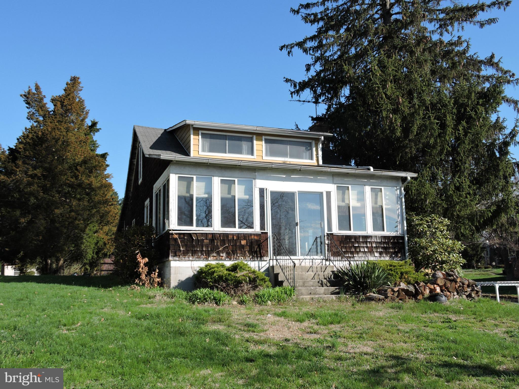 717 Red Cedar Road Annapolis, MD 21409 - Photo 22 of 30 a front view of a house with a yard