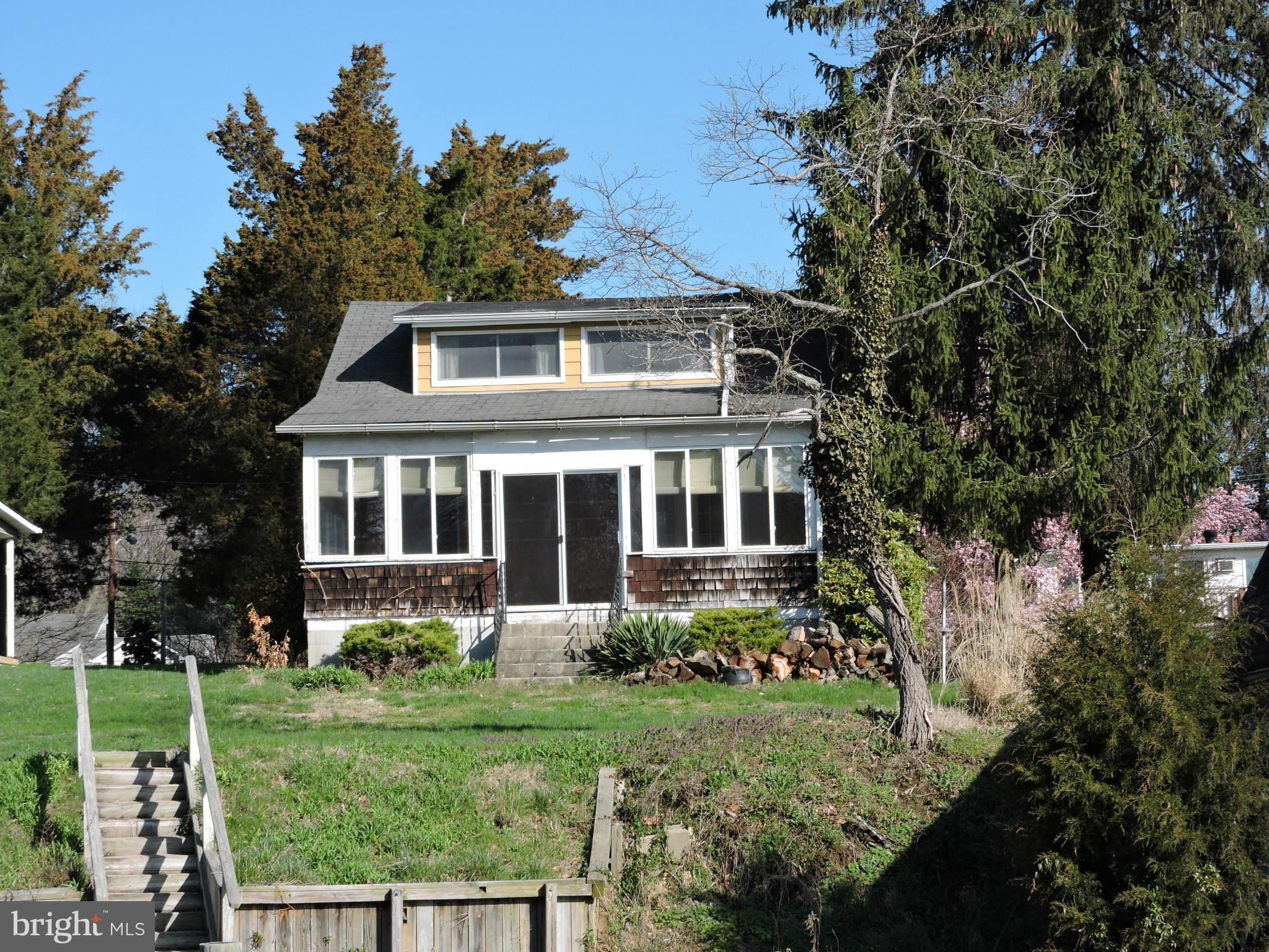 717 Red Cedar Road Annapolis, MD 21409 - Photo 26 of 30 a front view of a house with a yard