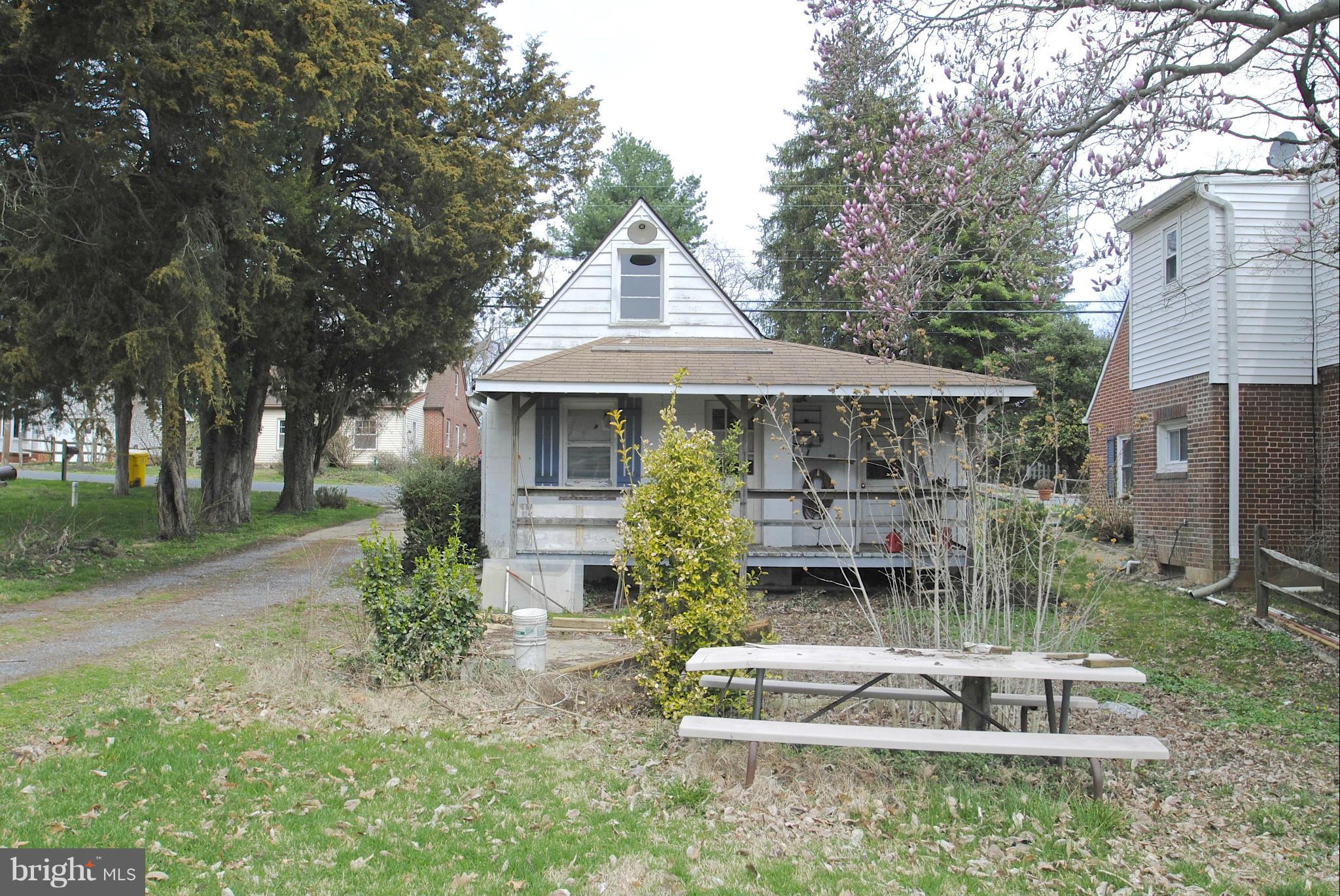 717 Red Cedar Road Annapolis, MD 21409 - Photo 29 of 30 a front view of a house with garden