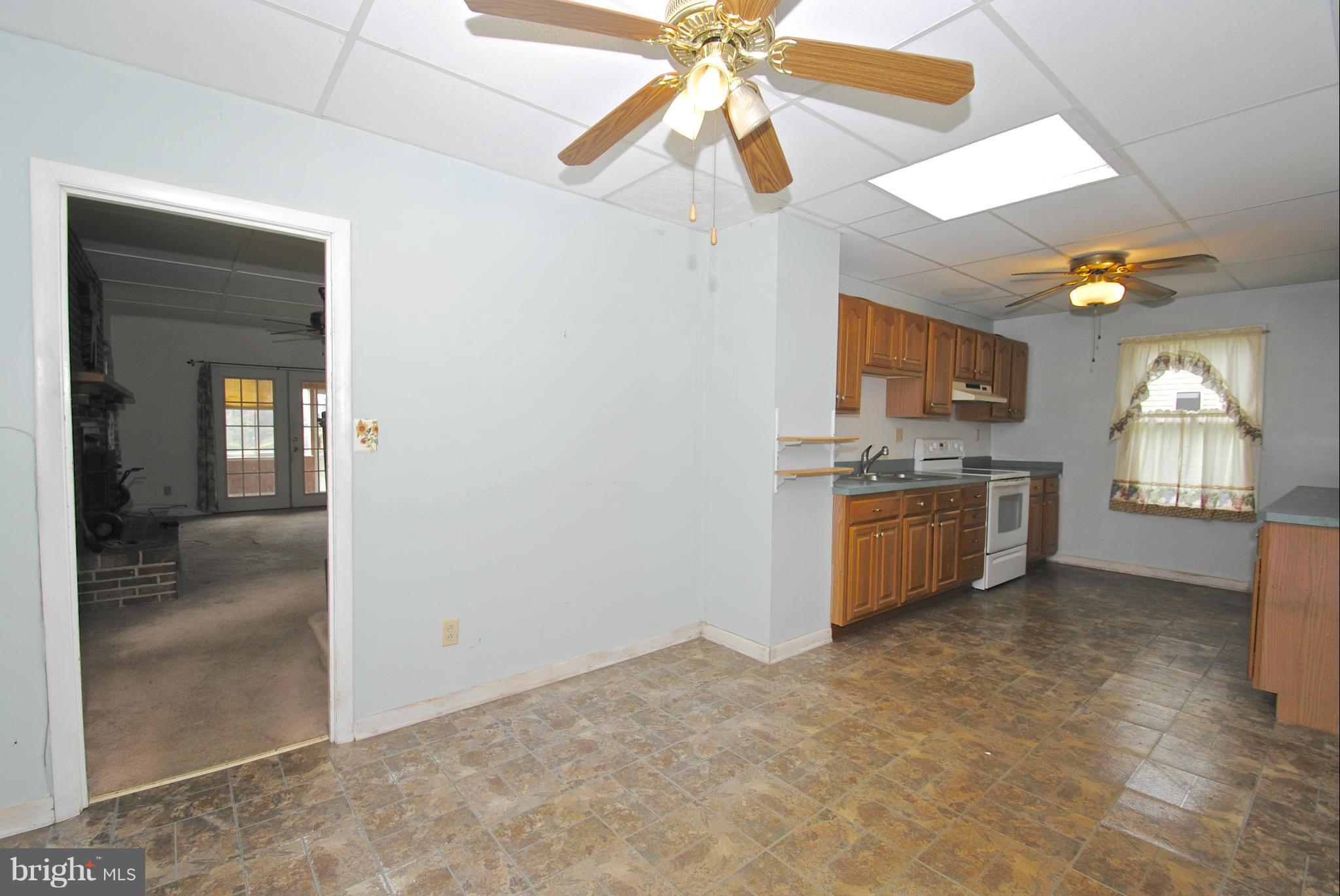 717 Red Cedar Road Annapolis, MD 21409 - Photo 6 of 30 a kitchen with a cabinets and chandelier